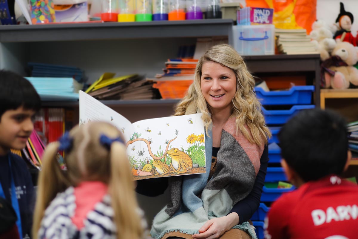 Laura Tapscott - EYFS Lead reading to Junior School pupils