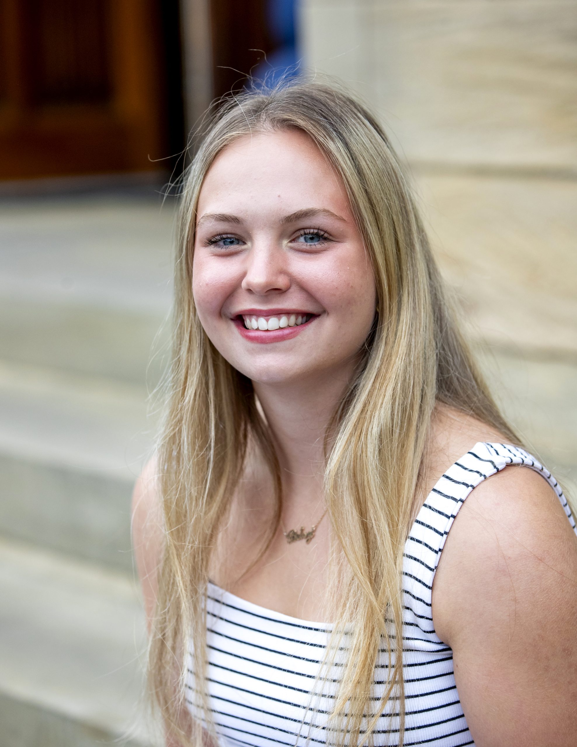 Betsy photographed at school after receiving her results.