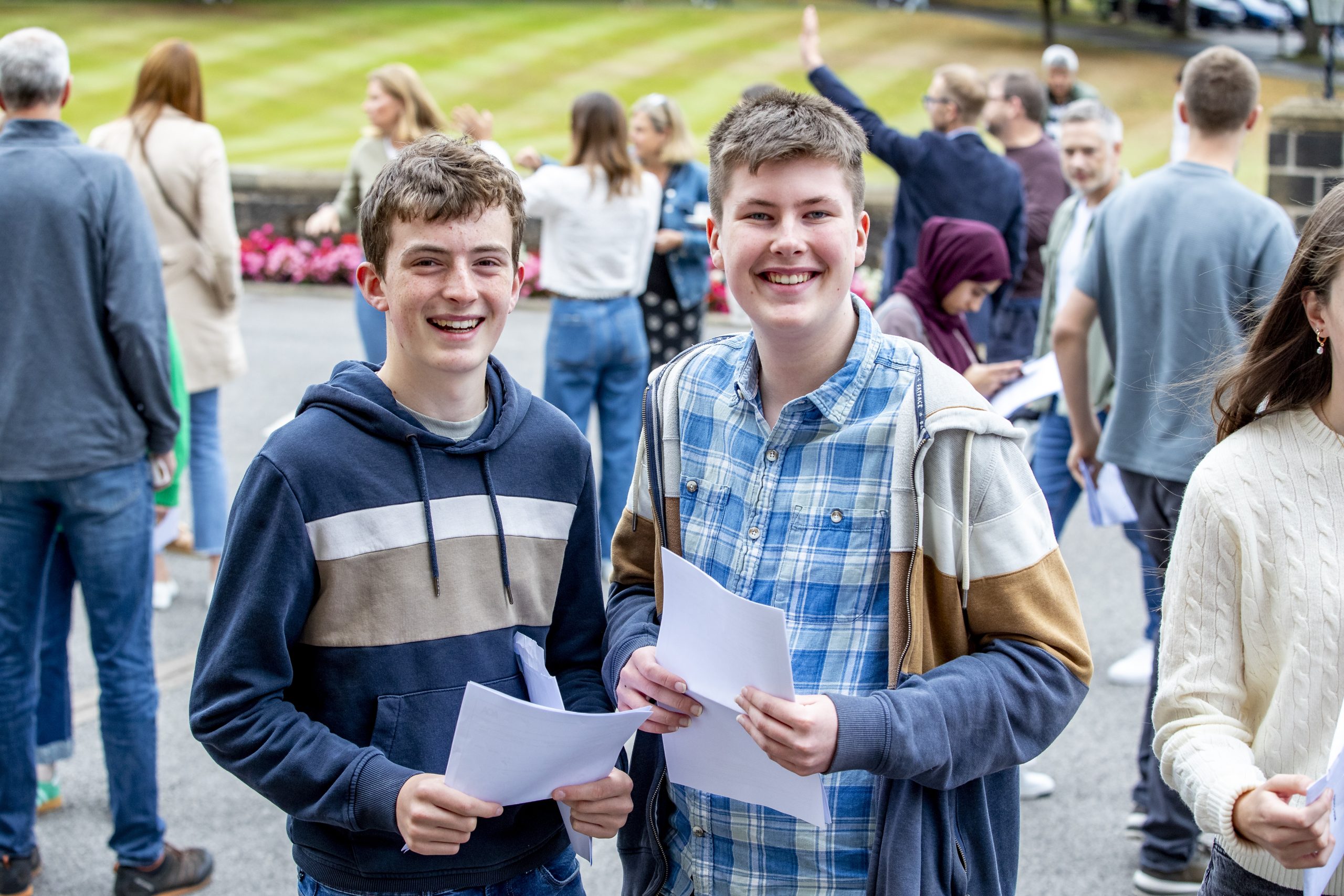 Joseph and Alex photographed after getting their results