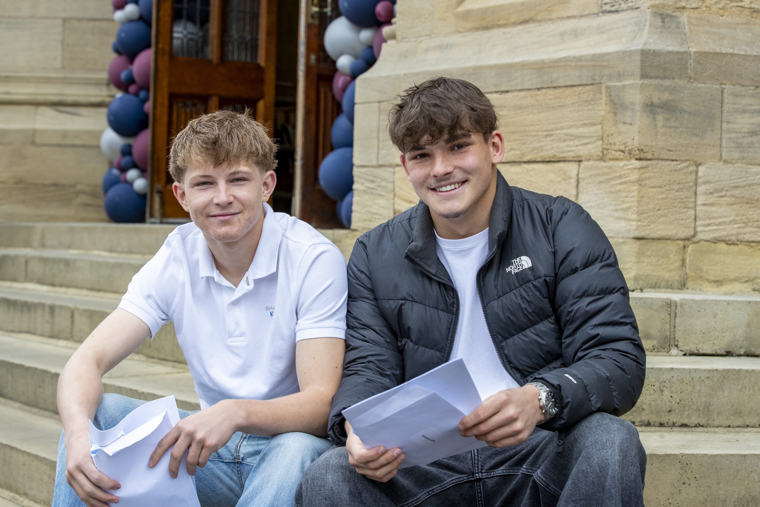 Harry and Jacob photographed together with their results