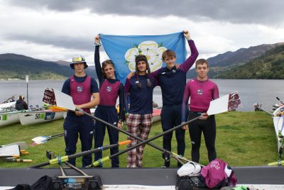 youngest competitiors at Monster the Loch Isaac smiling holding his gold medal