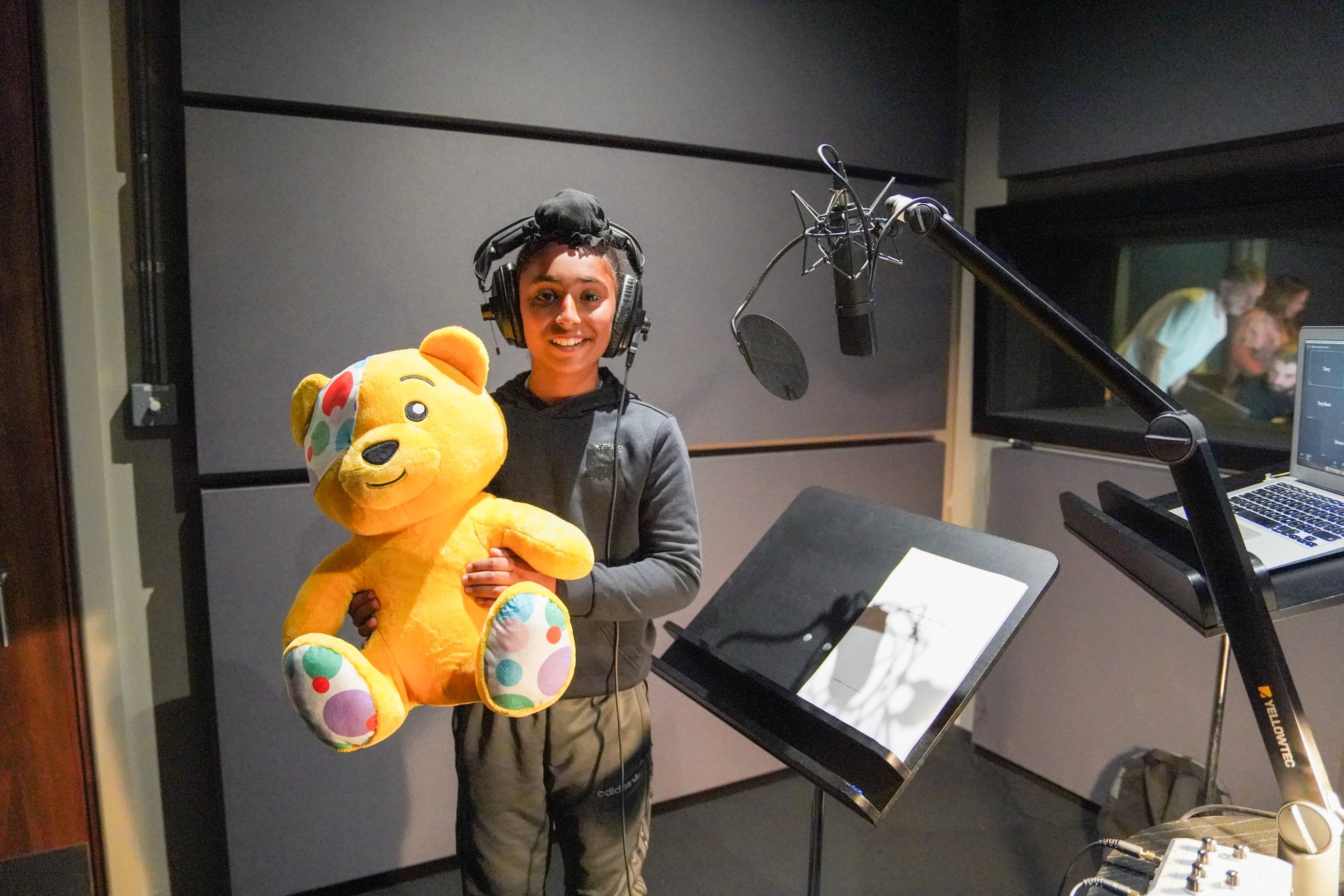 Daya and pudsey Isaac smiling holding his gold medal